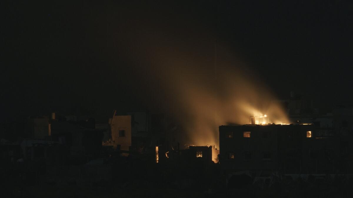 Flames engulf a building following an Israeli airstrike in the Gaza Strip, as seen from southern Israel, Thursday, Nov. 23, 2023. AP