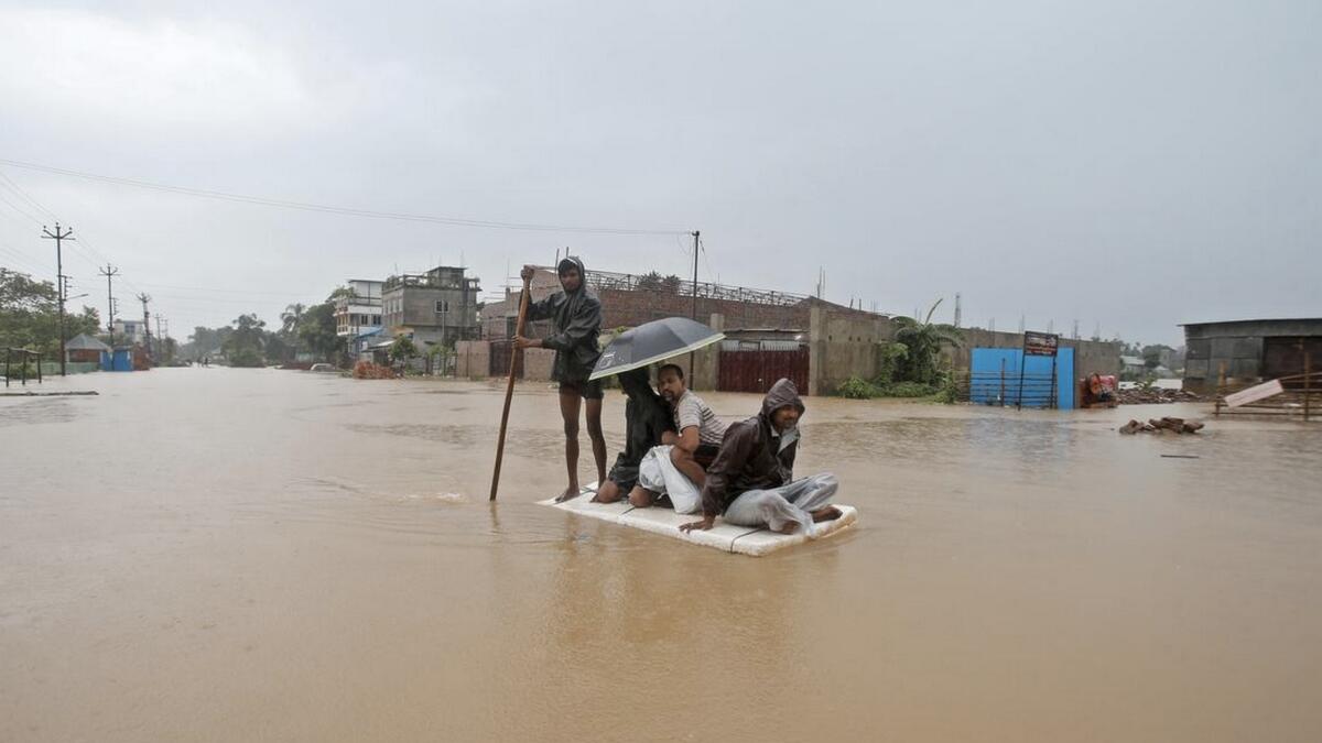 Millions stranded in India as early monsoon downpours bring flood havoc
