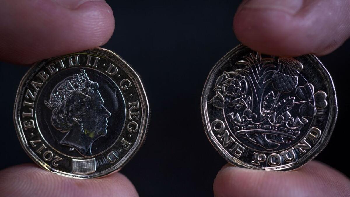 New pound coins lighter and slightly bigger than old ones