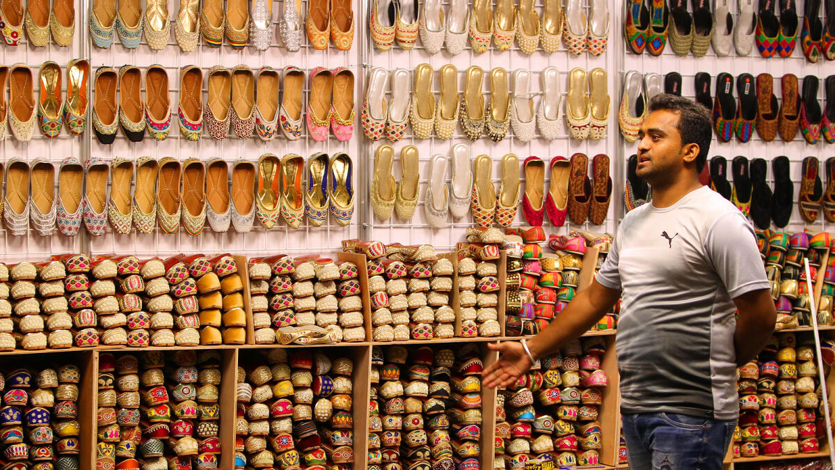 BEST BUYS... A vendor at  chappalwala stall calling visitors to have a look at the collection of beautifully-crafted footwear from the Indian sub continent.