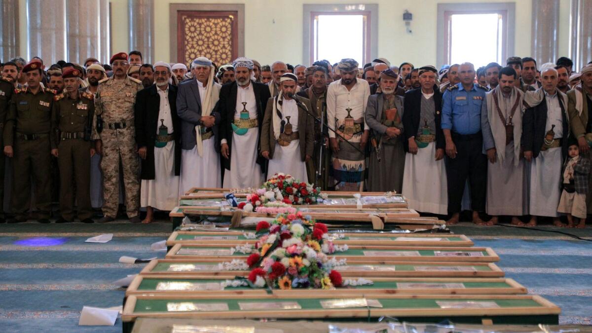 Mourners hather to pray near the coffins of Huthi rebels who were killed in recent US-led strikes, in Sanaa's Al-Saleh mosque during their funeral ceremony on February 10, 2024. AFP
