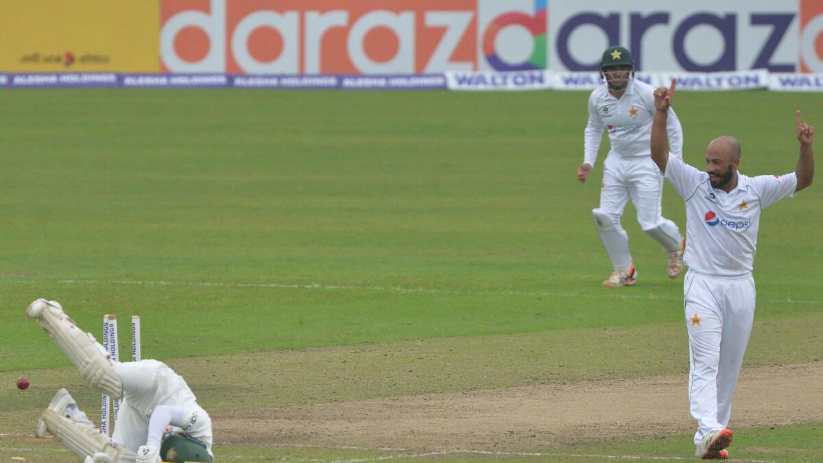 Pakistan's Sajid Khan (right) celebrates after the dismissal of Bangladesh captain Mominul Haque. (AFP)