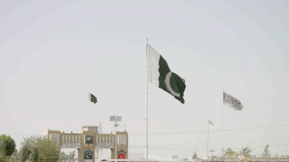 Pakistan and Taliban flags at the Friendship Gate crossing point in the Pakistan-Afghanistan border town of Chaman. — Reuters