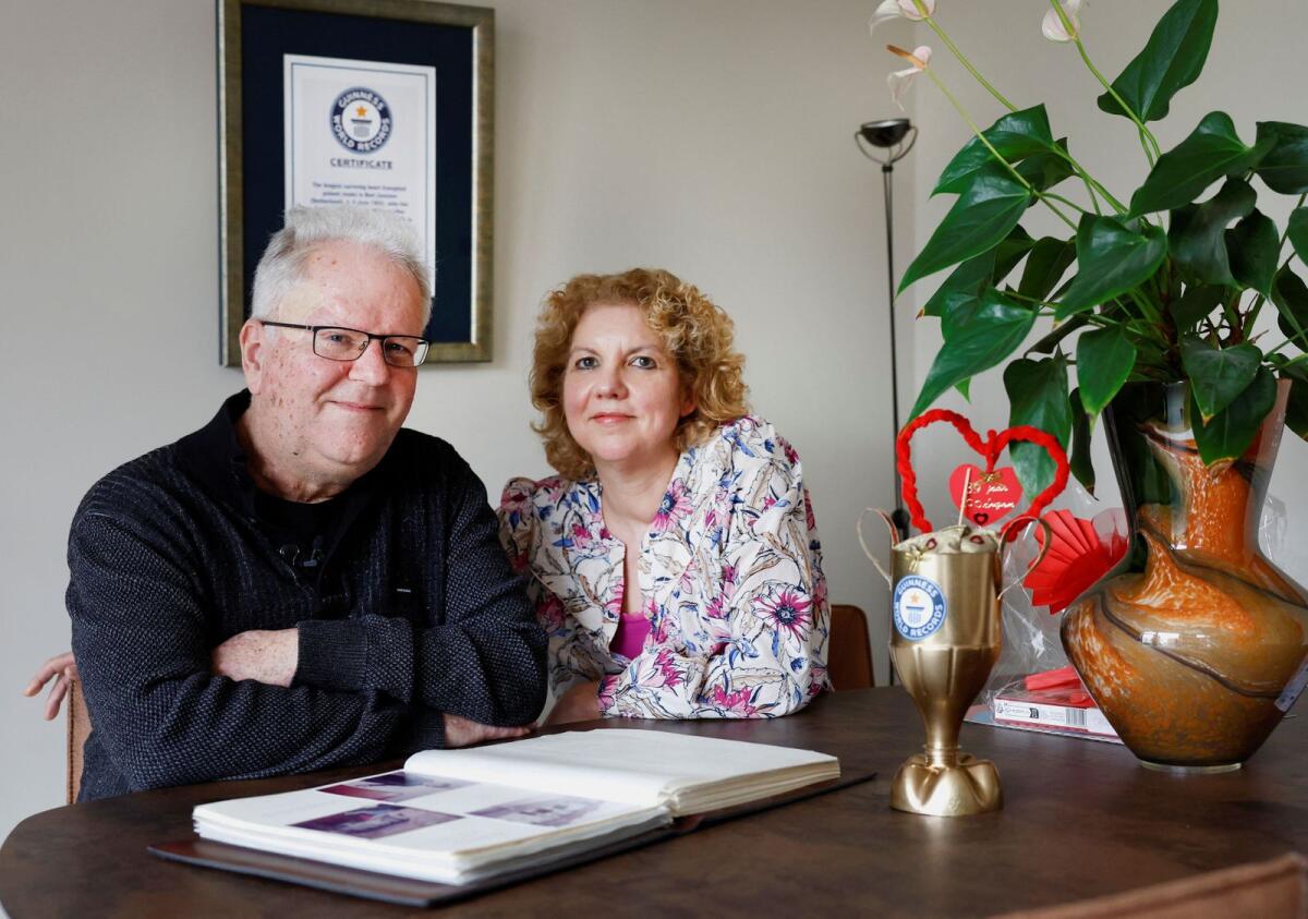 Bert Janssen, 57 years old, and his wife Petra pose in their house in Herkenbosch, Netherlands on February 29, 2024. — Reuters