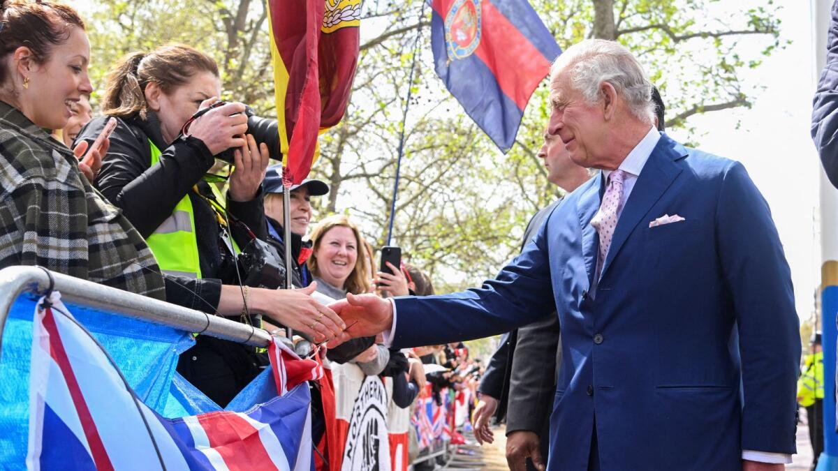 Britain's King Charles meets well-wishers on Friday during a walkabout outside Buckingham Palace ahead of his and Camilla, Queen Consort's coronation, in London. — Reuters
