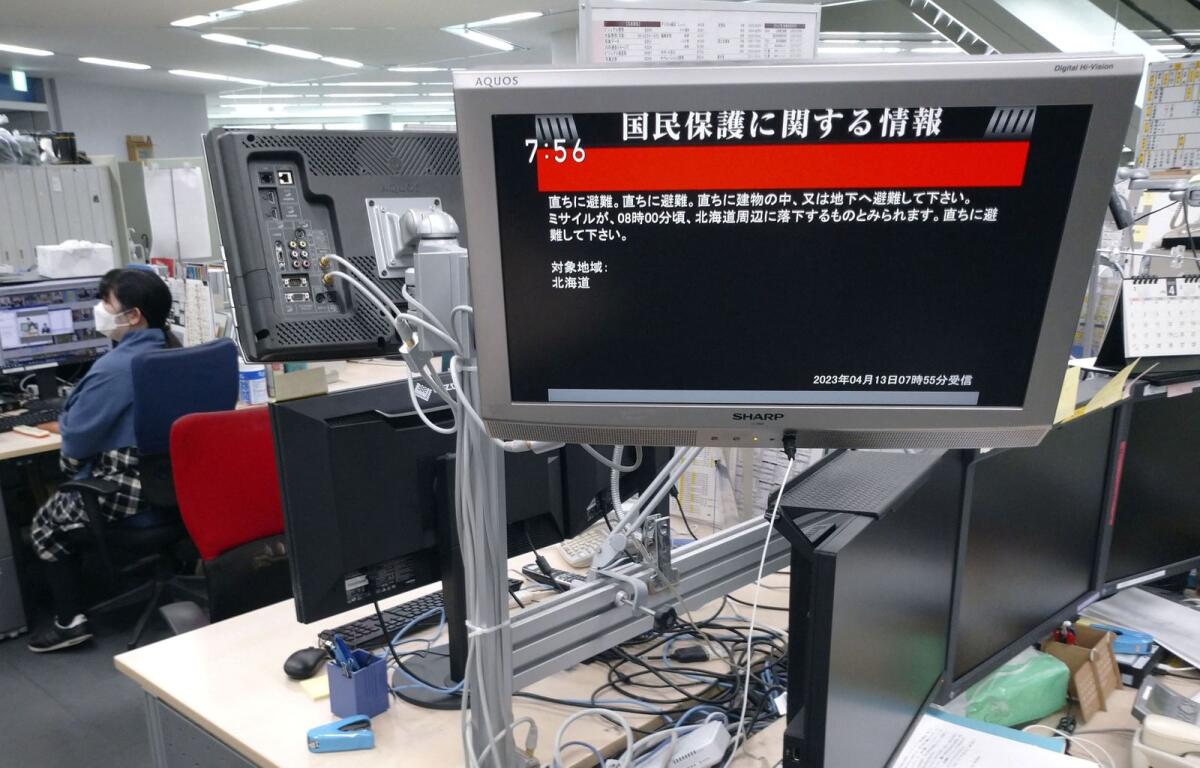 A TV screen displays a warning message called 'J-alert' after the Japanese government. Photo: Reuters