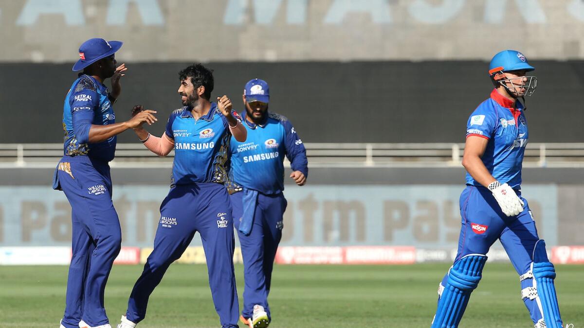 Jasprit Bumrah celebrates the wicket of Marcus Stoinis with his teammates. — IPL