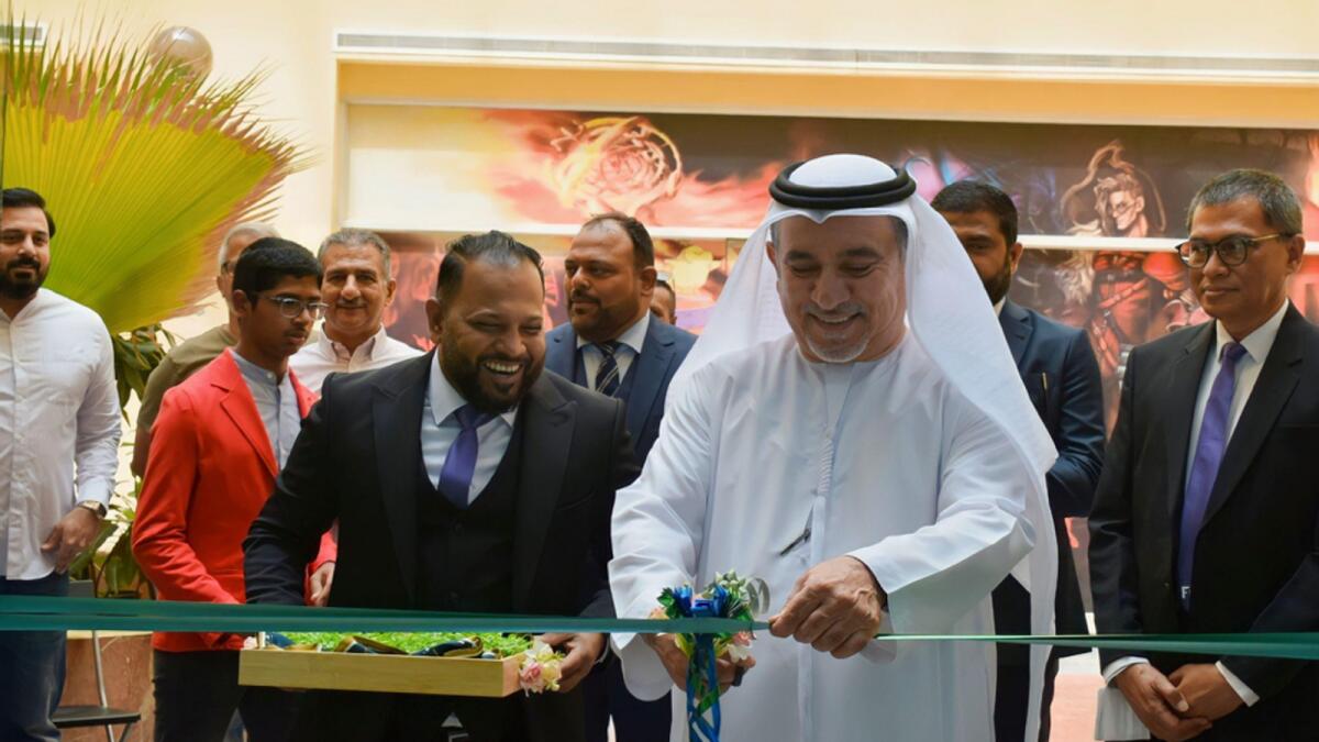 Ali Balushi cutting the ribbon at the opening ceremony of FCB