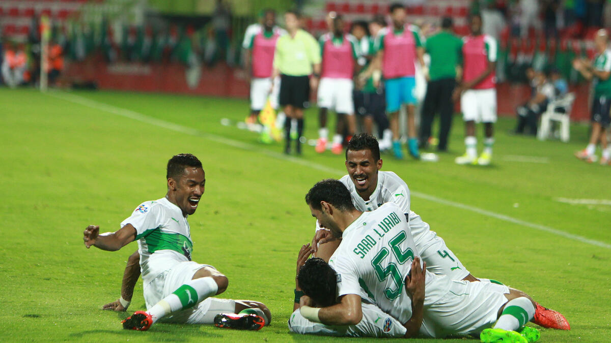 Hussain Al Moqhahwi of Al Ahli Saudi DC and other players celebrates goal against Al Ahli UAE during AFC champions league at Rashid stadium on Monday.