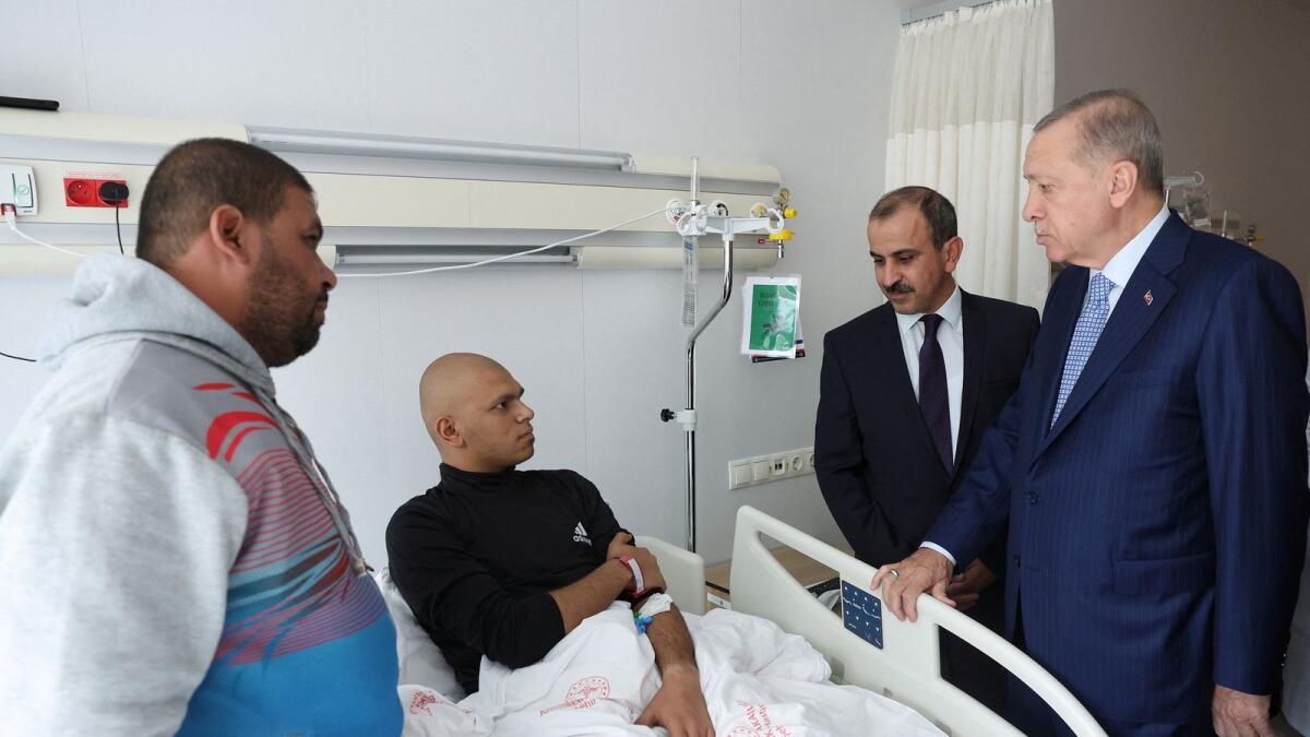 Turkish President Tayyip Erdogan visits a Palestinian cancer patient who was evacuated from Gaza to Egypt and brought to Turkey by plane, at Bilkent City Hospital in Ankara. — Reuters