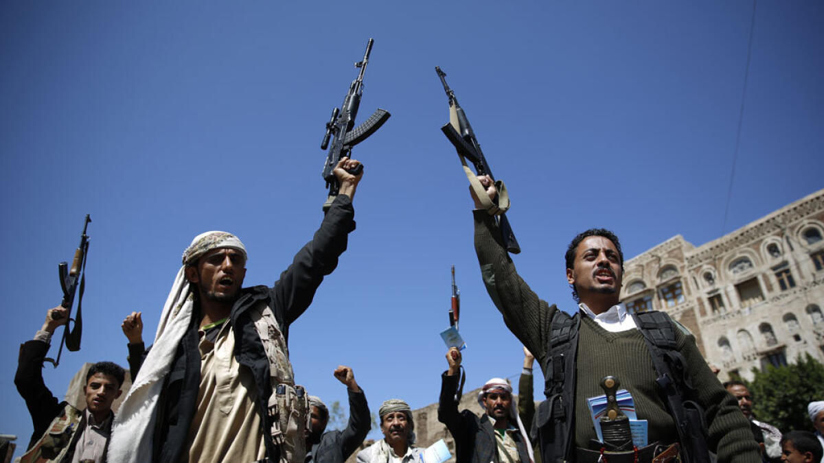 Houthi militants holding their weapons chant slogans during a tribal gathering. — File photo