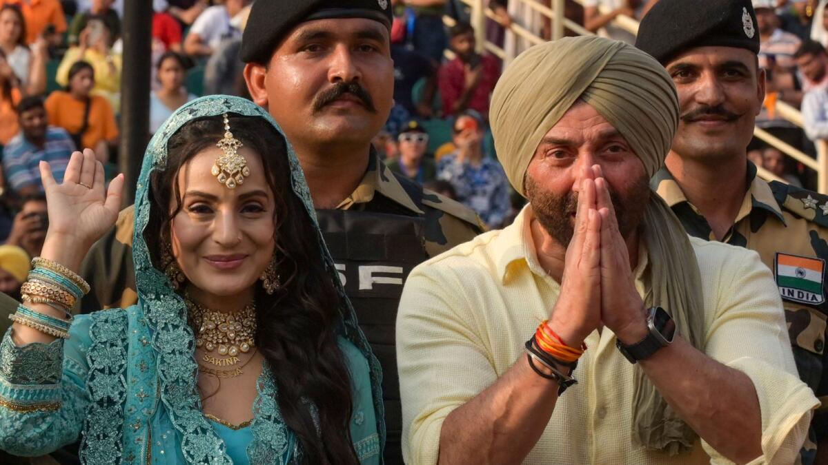 Bollywood actors Sunny Deol (R) and Ameesha Patel attend the promotion of their upcoming film ‘Gadar 2’ at the India-Pakistan Wagah border post. — AFP