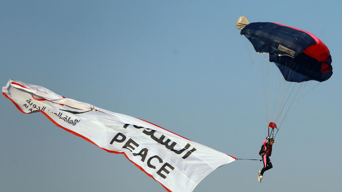 Misty Blues all-women skydiving team performs at Al Ain Airshow.