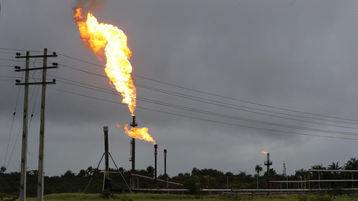 Gas flares burn from pipes at an oil flow station operated by Nigerian Agip Oil Co. Ltd in Idu, Rivers State, Nigeria. Nigerian output posted Opec's biggest increase of 100,000 bpd in February. - KT file