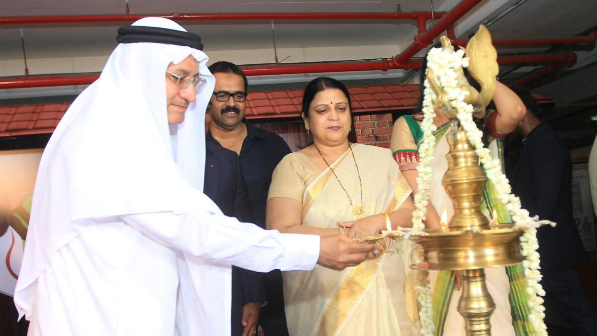 Humaid Mohammad Al Qutami, Director-General of Dubai Health Authority, with Onam fest officials during the lighting the lamp ceremony at the opening of Onam fest at Ansar Mall in Sharjah on Thursday – Photo by M.Sajjad