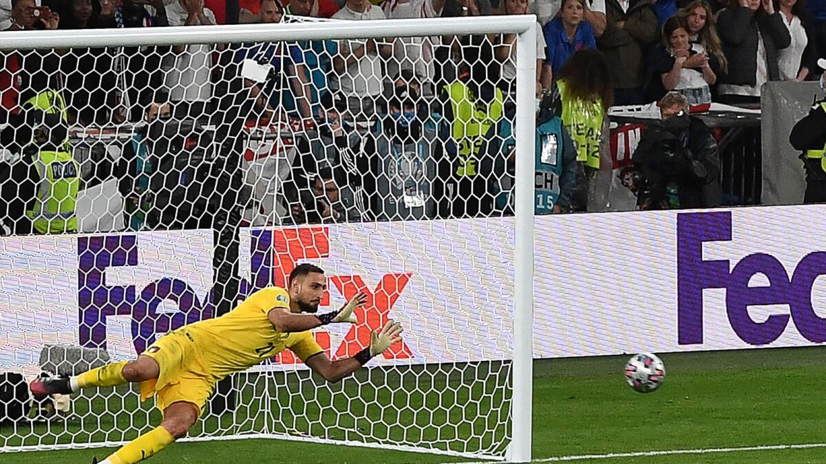Italy's goalkeeper Gianluigi Donnarumma saves a penalty to win the Uefa Euro 2020 final against England at the Wembley Stadium. — AFP