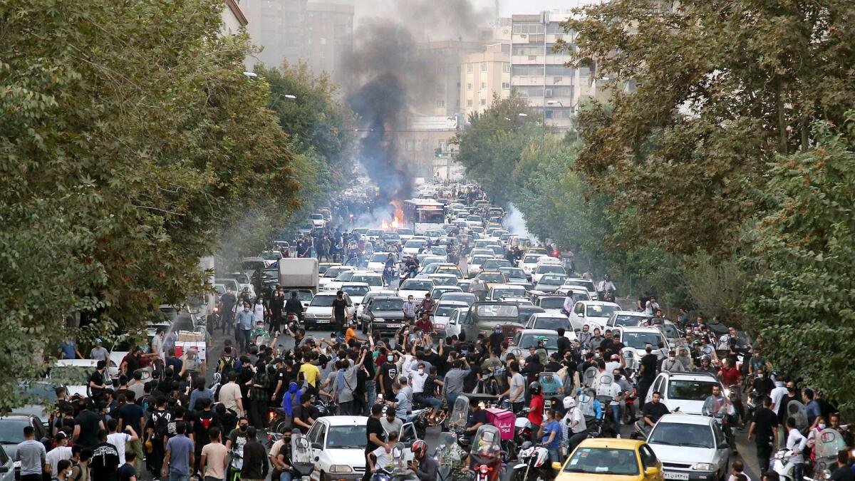 In this supplied photo, protesters chant slogans during a protest over the death of a woman who was detained by the morality police in downtown Tehran. — AP file