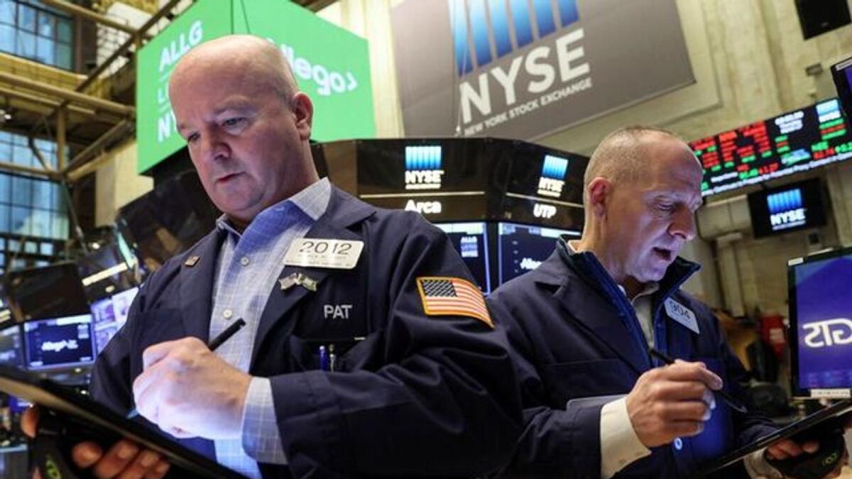 Traders at the New York Stock Exchange.  Investors have been drawn to the large companies broadly because of their financial strength and competitive advantages that, in theory, will drive profits even during uncertain economic times.