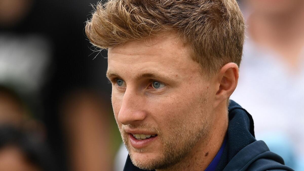 Joe Root would be expected to take a pay cut of approximately 200,000 pounds. - AFP