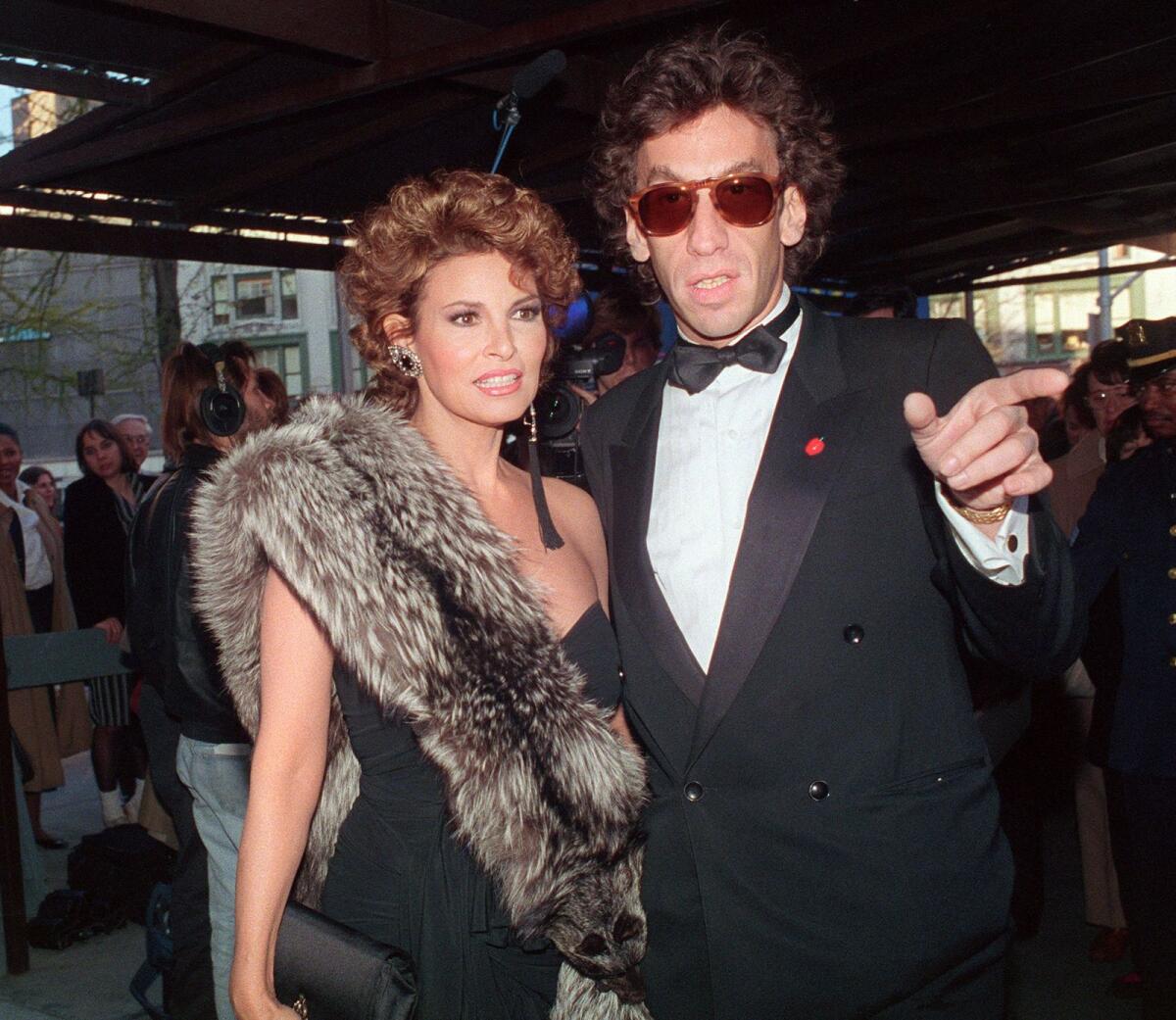 In this file photo taken on April 25, 1988, actress Raquel Welch and her husband André Steinfeld smile in New York as they arrive at Lincoln Center for a concert