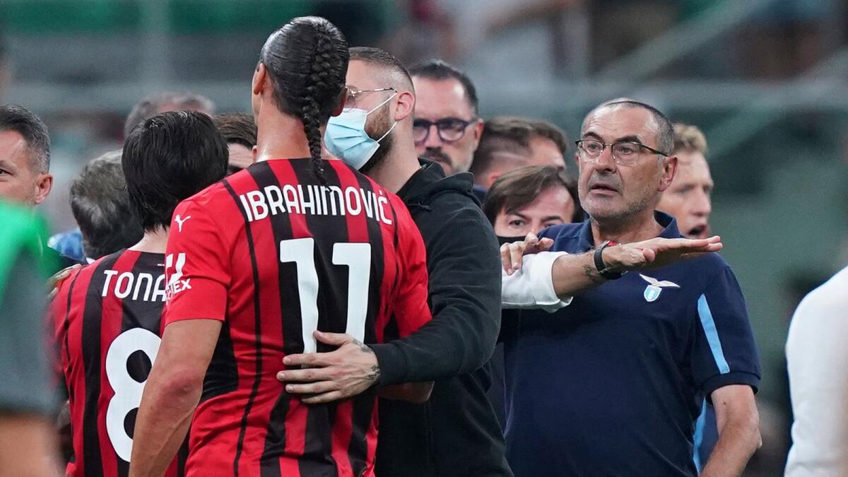 Lazio's coach Maurizio Sarri (right) gets a red card at the end of the Italian Serie A soccer match against AC Milan. — AP
