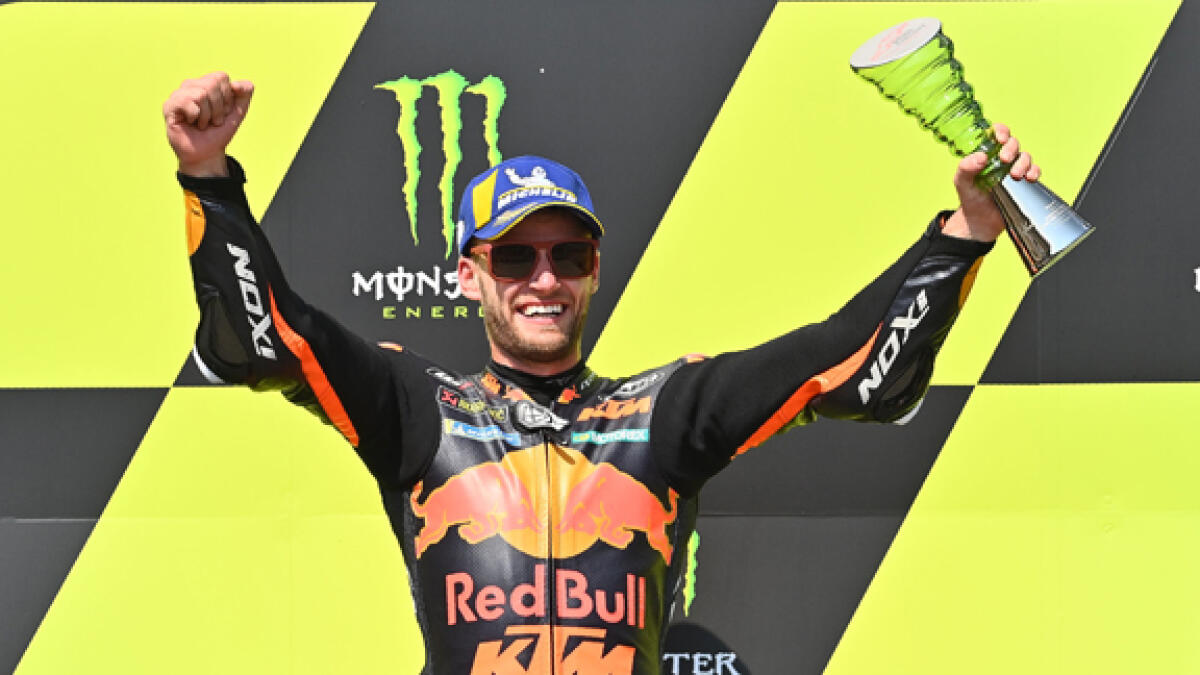 Red Bull KTM Factory Racing´s South African Brad Binder celebrates after winning the Moto GP Czech Grand Prix. - AFP