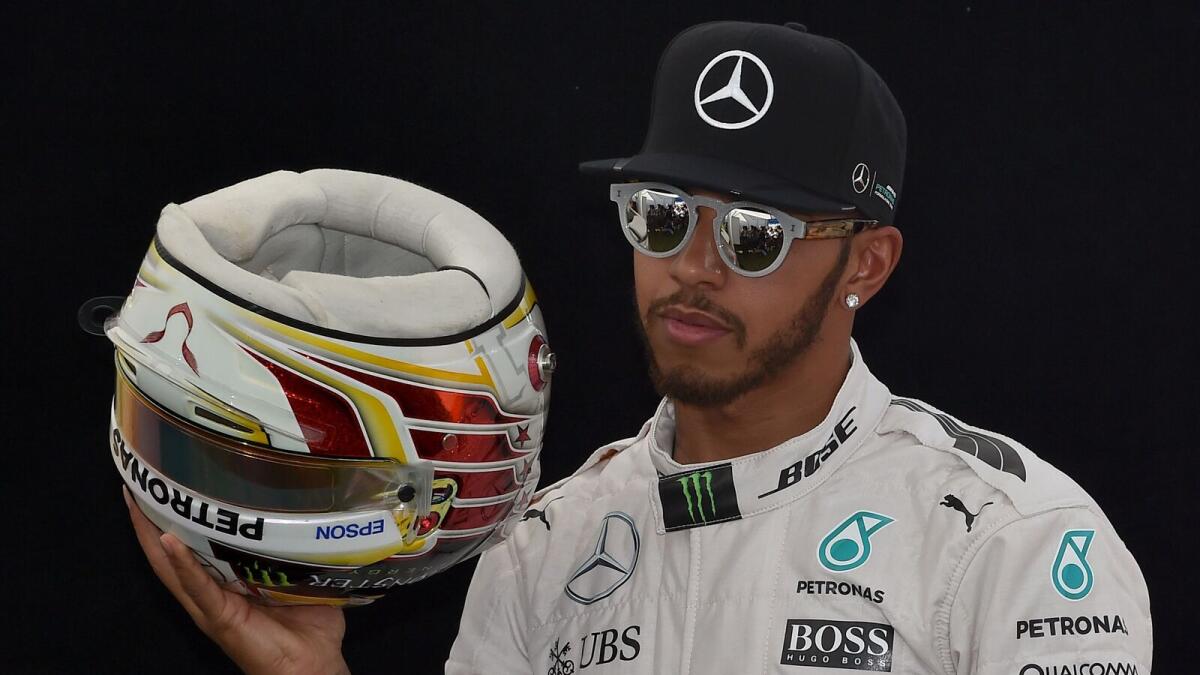 Mercedes AMG Petronas F1 Team's British driver Lewis Hamilton poses for the annual drivers portrait picture ahead of the Australian Formula One Grand Prix in Melbourne on March 17, 2016. --IMAGE RESTRICTED TO EDITORIAL USE - STRICTLY NO COMMERCIAL USE--/ AFP / Paul Crock / --IMAGE RESTRICTED TO EDITORIAL USE - STRICTLY NO COMMERCIAL USE--