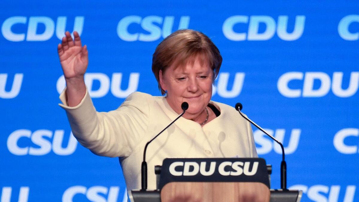 German Chancellor Angela Merkel addresses the last rally of the conservative Christian Democratic Union CDU and Social Union CSU in Munich. Photo: AFP