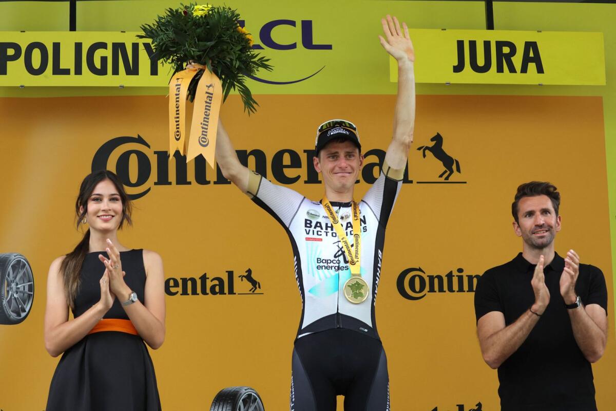 Bahrain - Victorious' Slovenian rider Matej Mohoric celebrates his victory on the podium after winning the 19th stage of the Tour de France. - AFP
