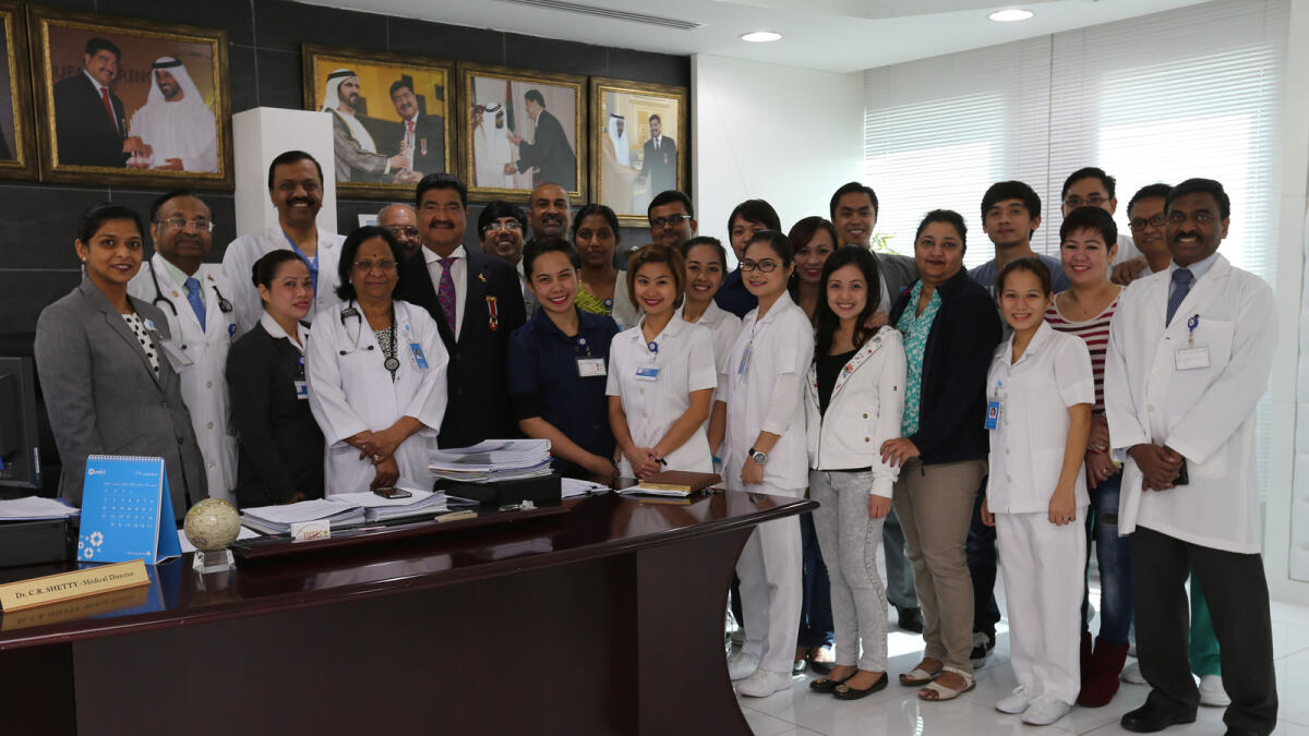 Dr B.R. Shetty with staff from his NMC healthcare business.