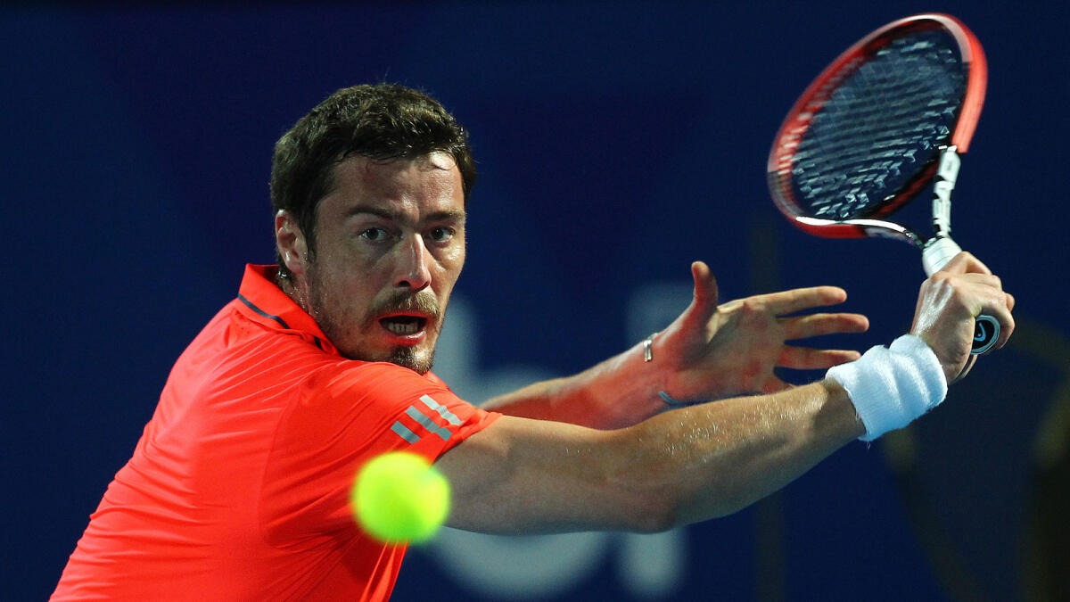 Marat Safin in action against Goran Ivanisevic. The Russian won his match 6-3. 