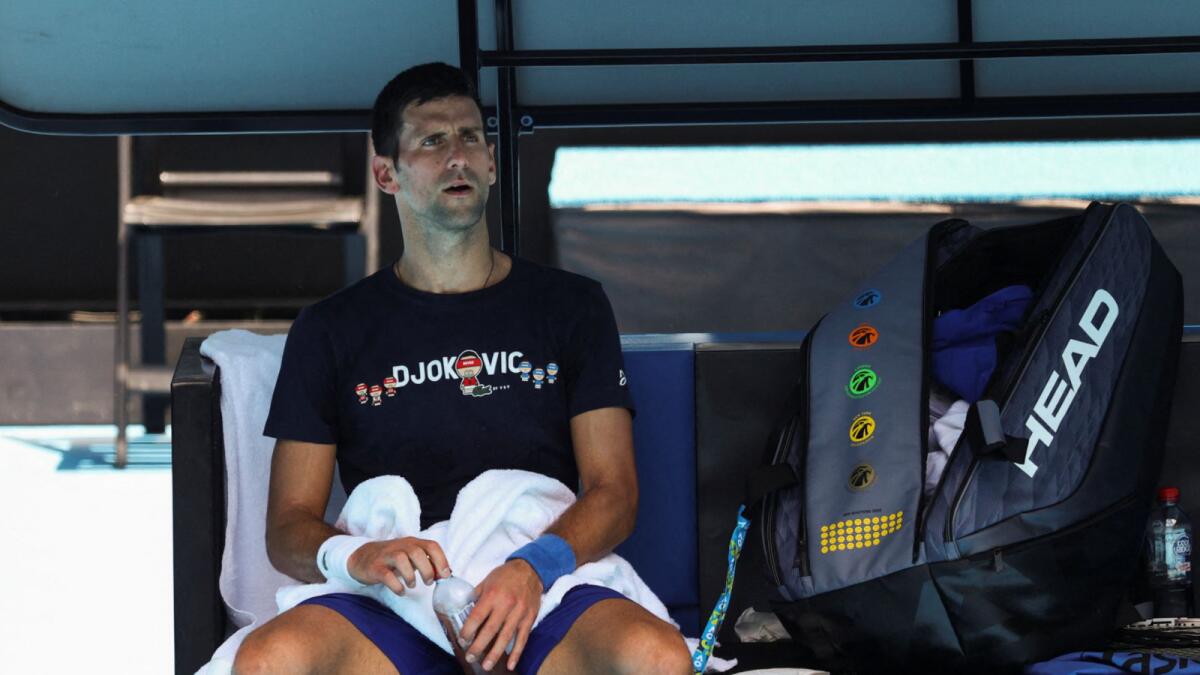 Novak Djokovic rests at Melbourne Park on Wednesday as questions remain over the legal battle regarding his visa to play in the Australian Open. — Reuters