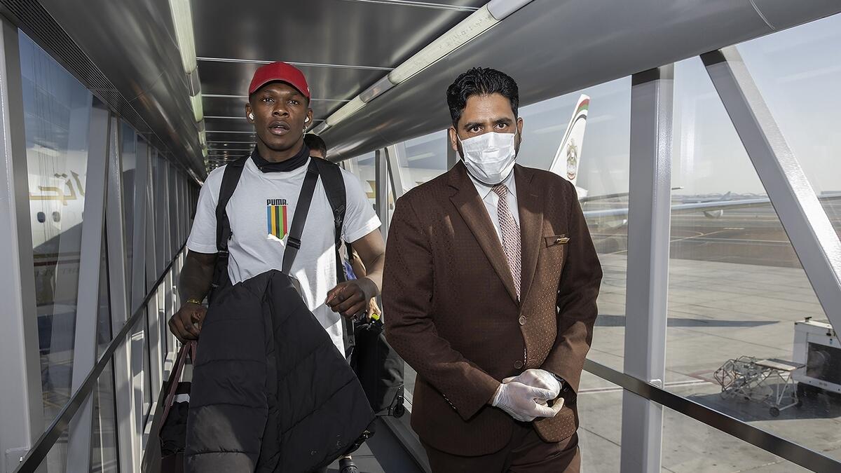 Israel Adesanya (left) arrives in Abu Dhabi from Las Vegas. (Supplied photo)