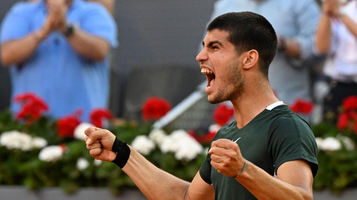 Carlos Alcaraz celebrates after winning against Novak Djokovic. (AFP)