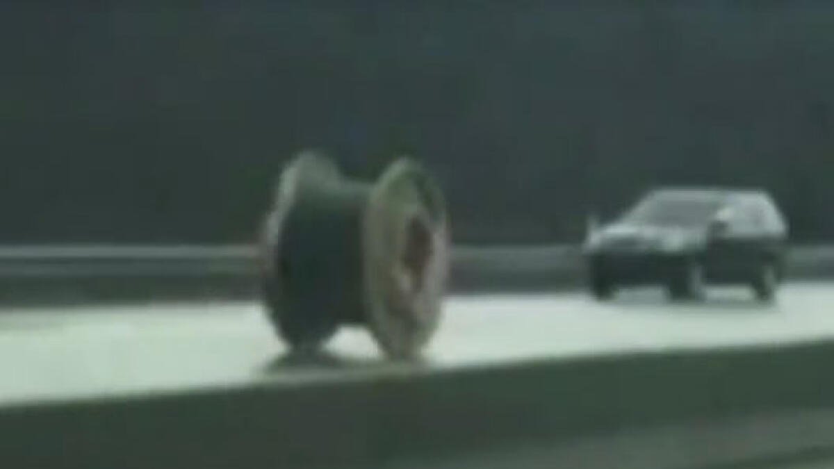Watch: Giant wire spool falls of truck, rolls down highway