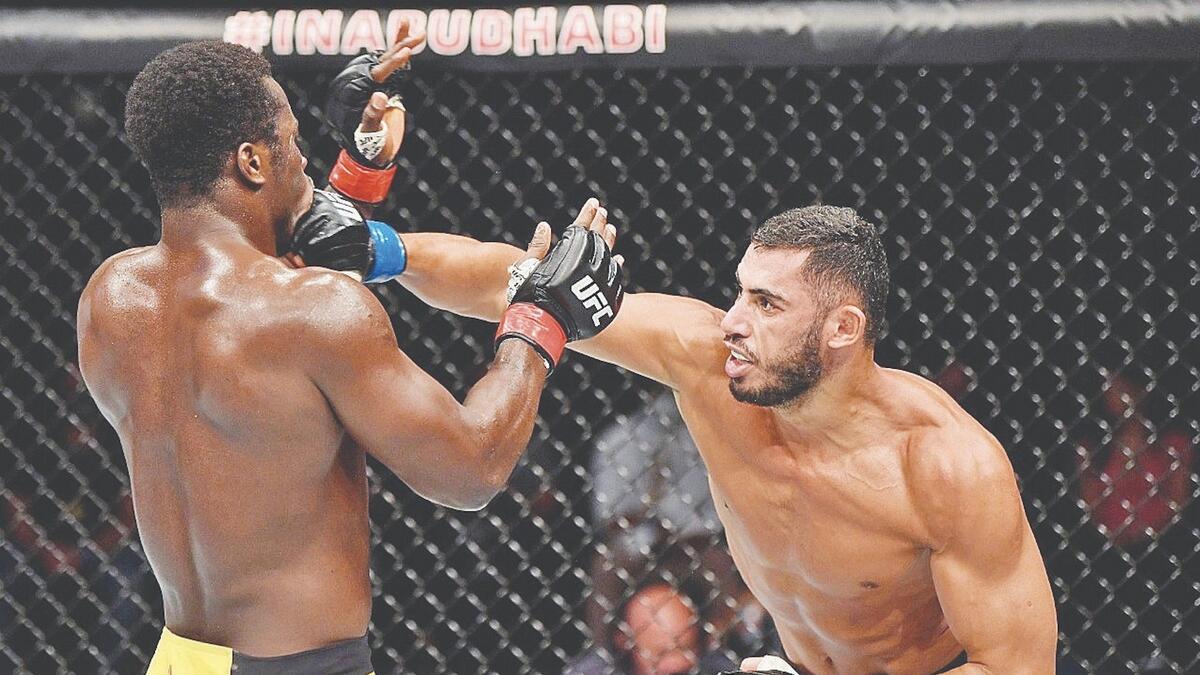UNSTOPPABLE: Mounir Lazzez of Tunisia punches Abdul Razak Alhassan of Ghana in their welterweight fight inside Flash Forum on UFC Fight Island on Thursday. - Wam