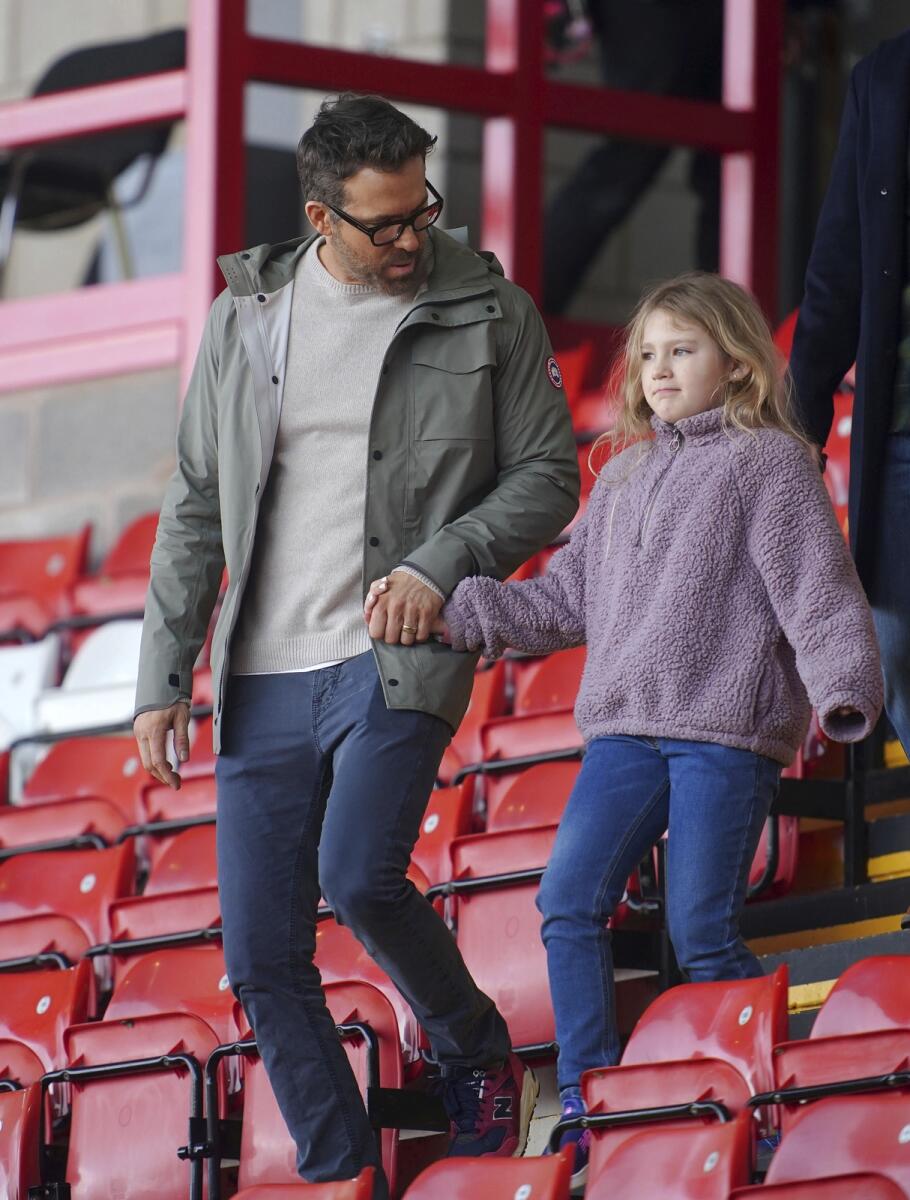 Reynolds with daughter at the match