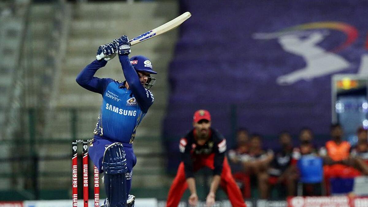 Quinton de Kock of Mumbai Indians plays a shot against RCB. — IPL