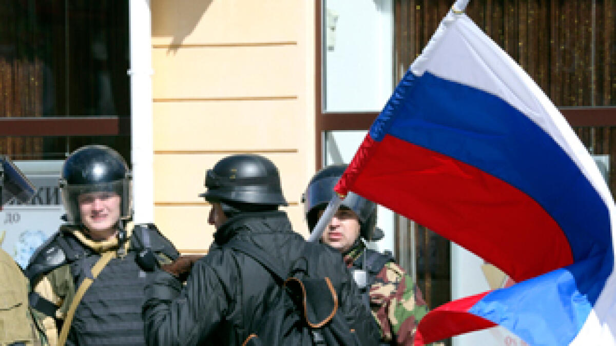 US, EU set sanctions as Putin recognises Crimea sovereignty