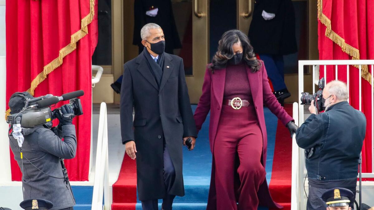 Former U.S. President Barack Obama and former first lady Michelle Obama arrive to the inauguration.