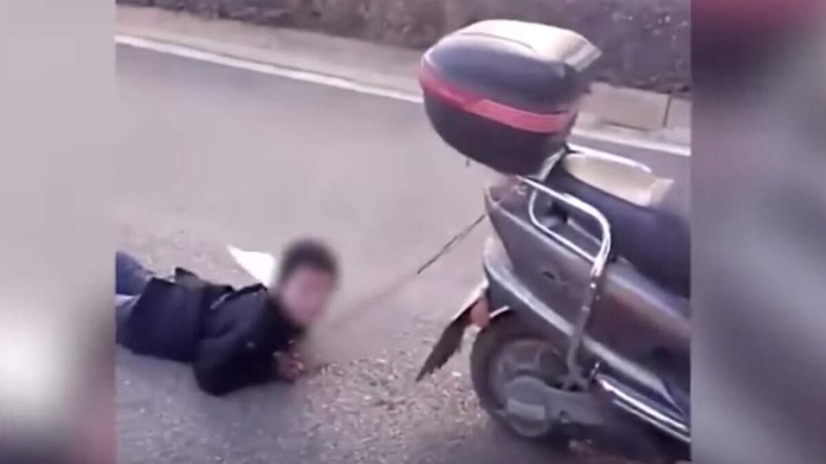 Video: Mother drags son behind scooter as punishment in China