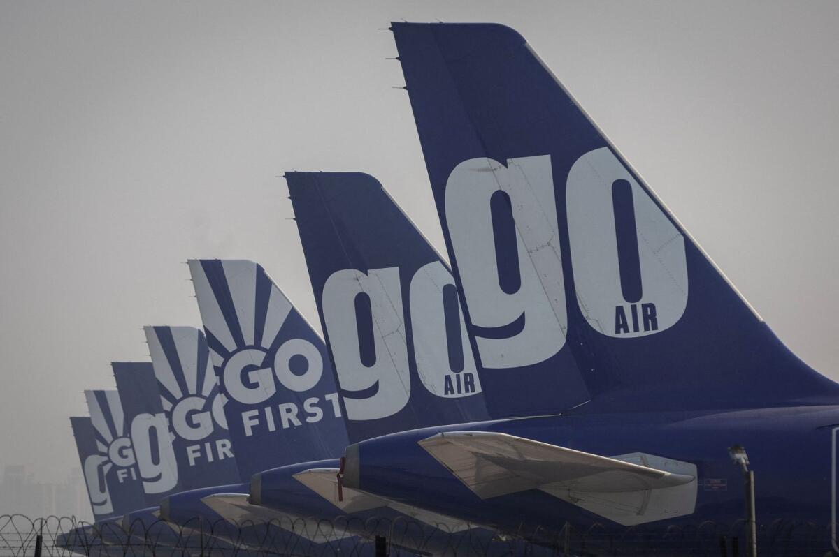 The tail fins of Go First airline, formerly known as GoAir, passenger aircraft are seen parked on the tarmac at the airport in New Delhi, India, on May 11, 2023. Photo: Reuters