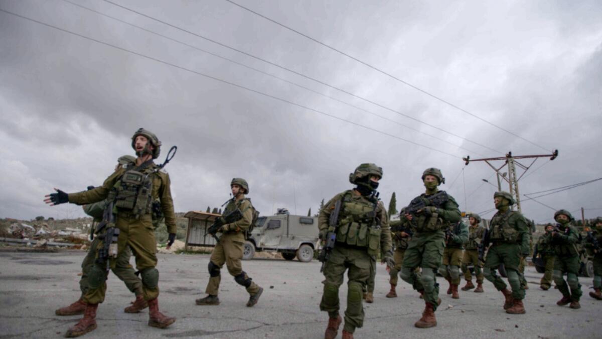Israeli soldiers patrol in the West Bank village of Burqa. — AP