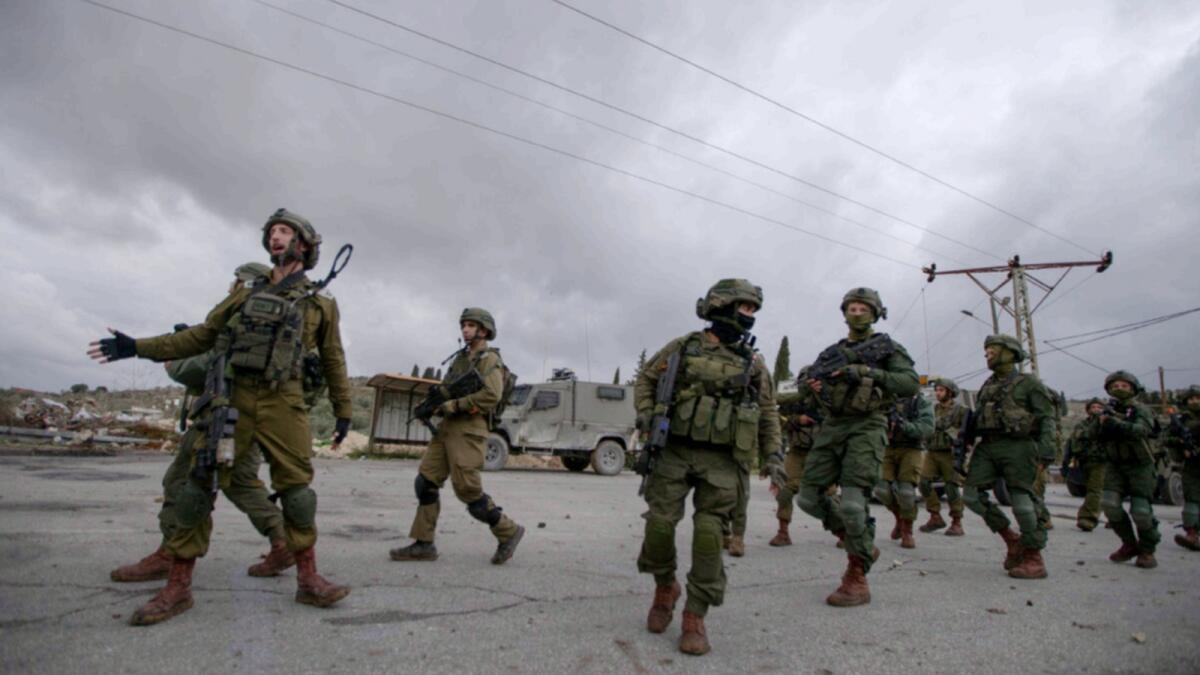 Israeli soldiers patrol in the West Bank village of Burqa. — AP