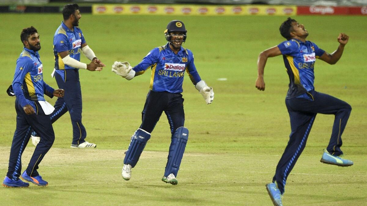 Sri Lanka's Maheesh Theekshana (right) celebrates with teammates after the dismissal of South Africa's Kagiso Rabada. (AFP)