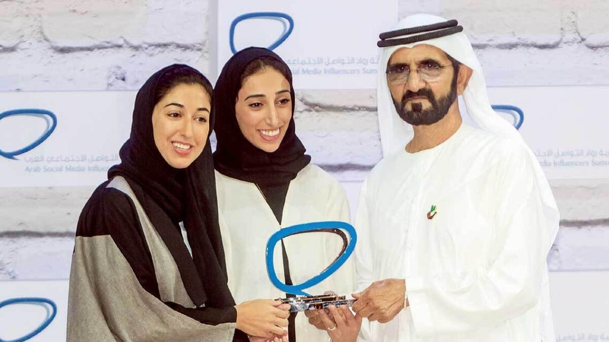 Deem Al Bassam and Amal Al Marri receiving the award in the shopping category.