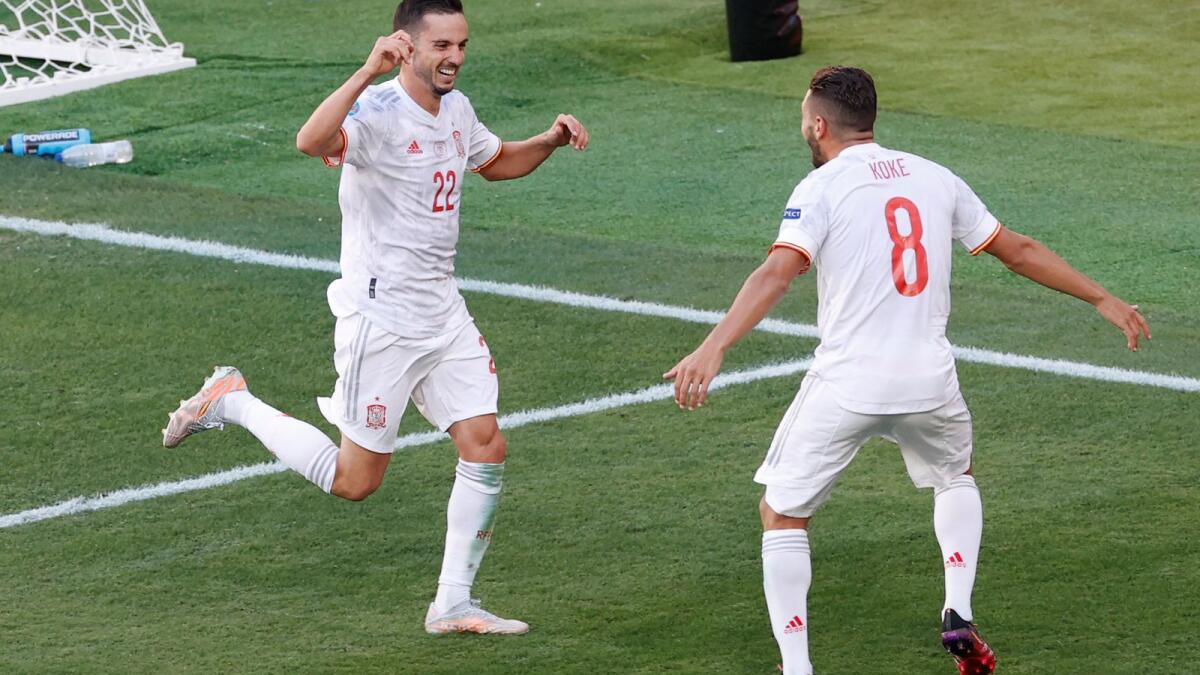 Spain's Pablo Sarabia (left) celebrates with Koke after scoring his side's third goal. (AP)
