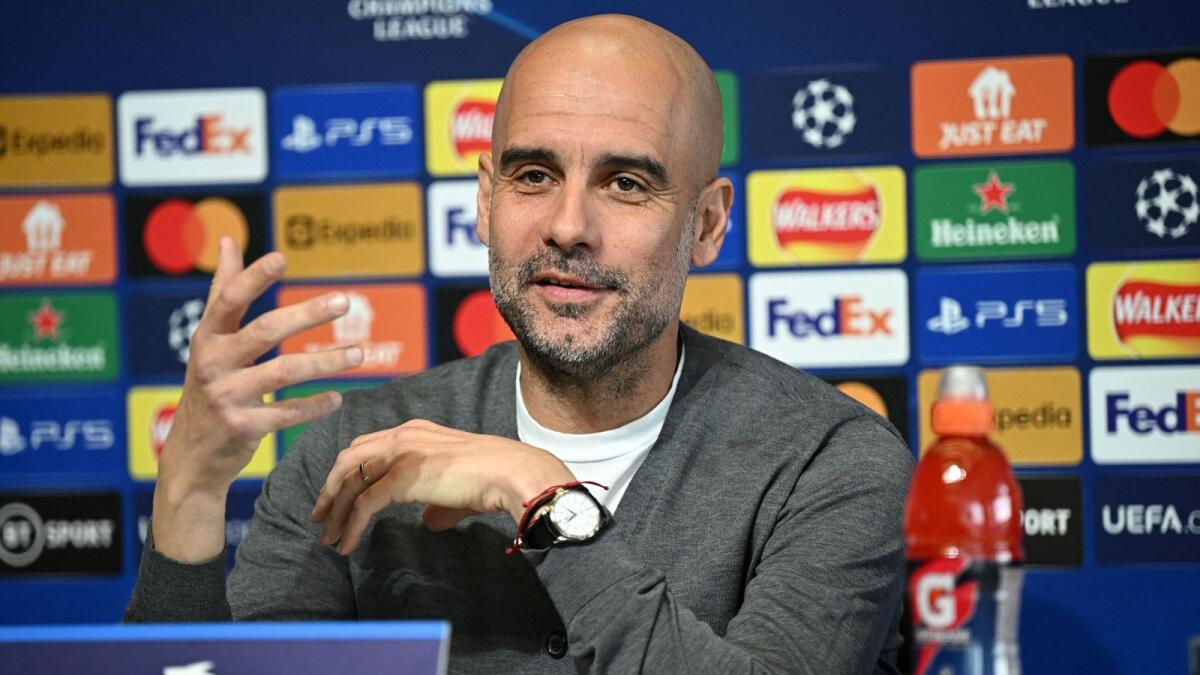Manchester City manager Pep Guardiola attends a press conference on Monday.  (AFP)