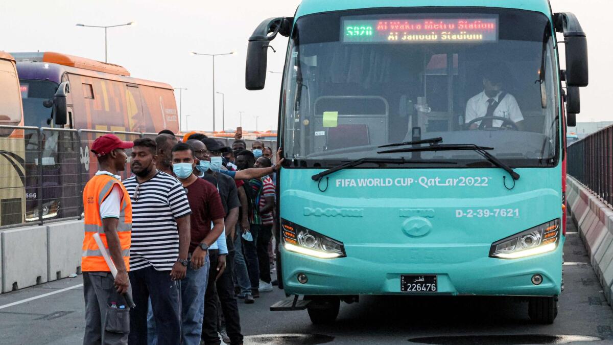 Passengers prepare to board a bus during the test run of 1300 vehicles by Mowasalat Qatar -- the official land transport provider in the gulf emirate. Qatar will host the 2022 Fifa World Cup from November 20 to December 18.  (AFP)
