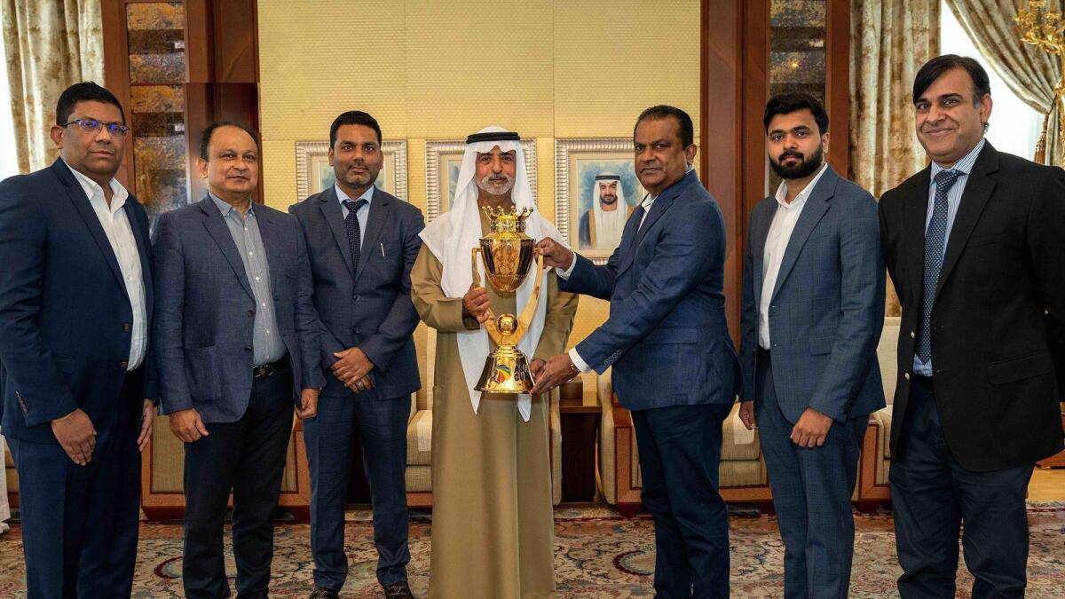 Sheikh Nahyan bin Mubarak Al Nahyan, Minister of Tolerance and Coexistence and Chairman of the Emirates Cricket Board, and cricket officials pose with the Asia Cup trophy. (Supplied photo)